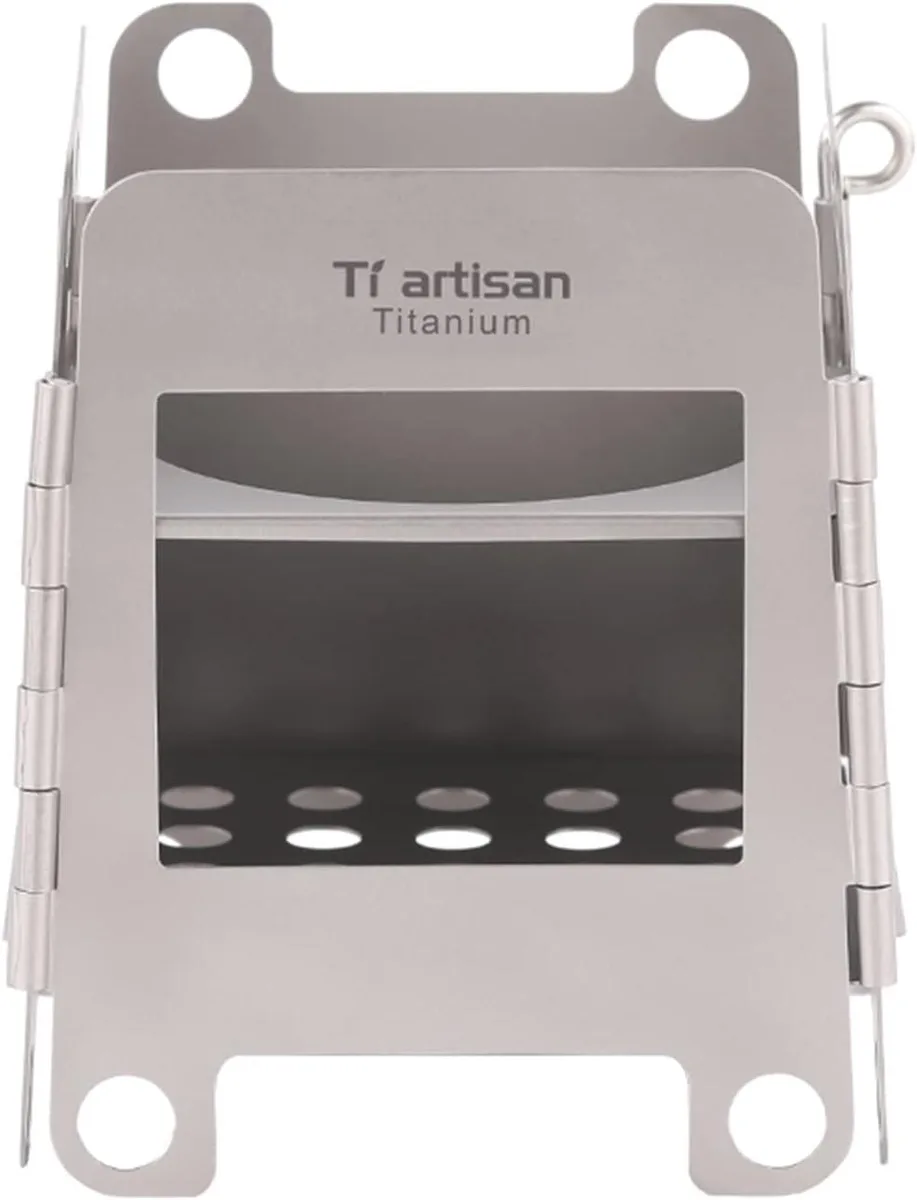 Foldable titanium wood stove, silver metal panels with vent holes, compact cube shape, carry bag included