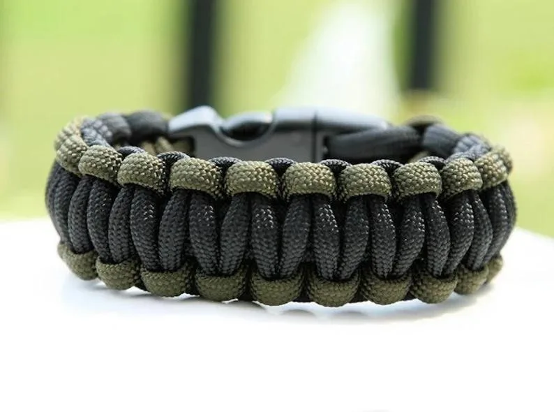 Green and tan paracord bracelet with plastic side release buckle
