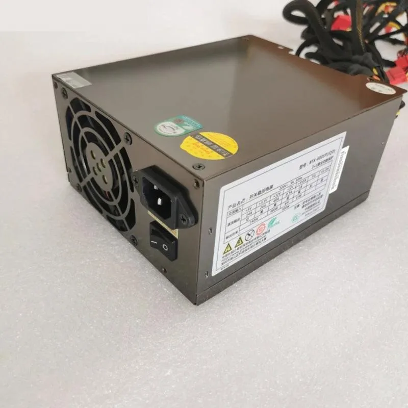 Black rectangular ATX power supply unit with gold certification badge