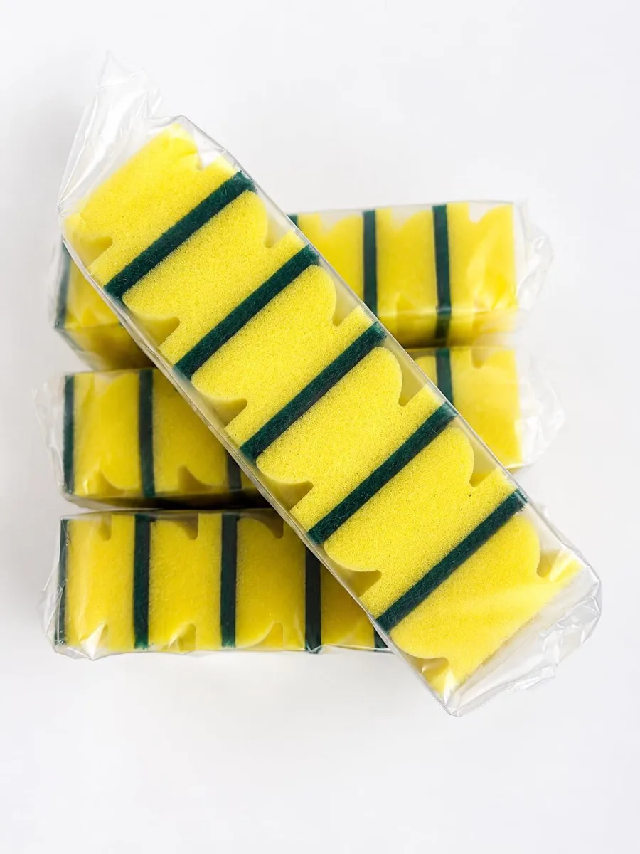 Six rectangular yellow and green sponges in a pack