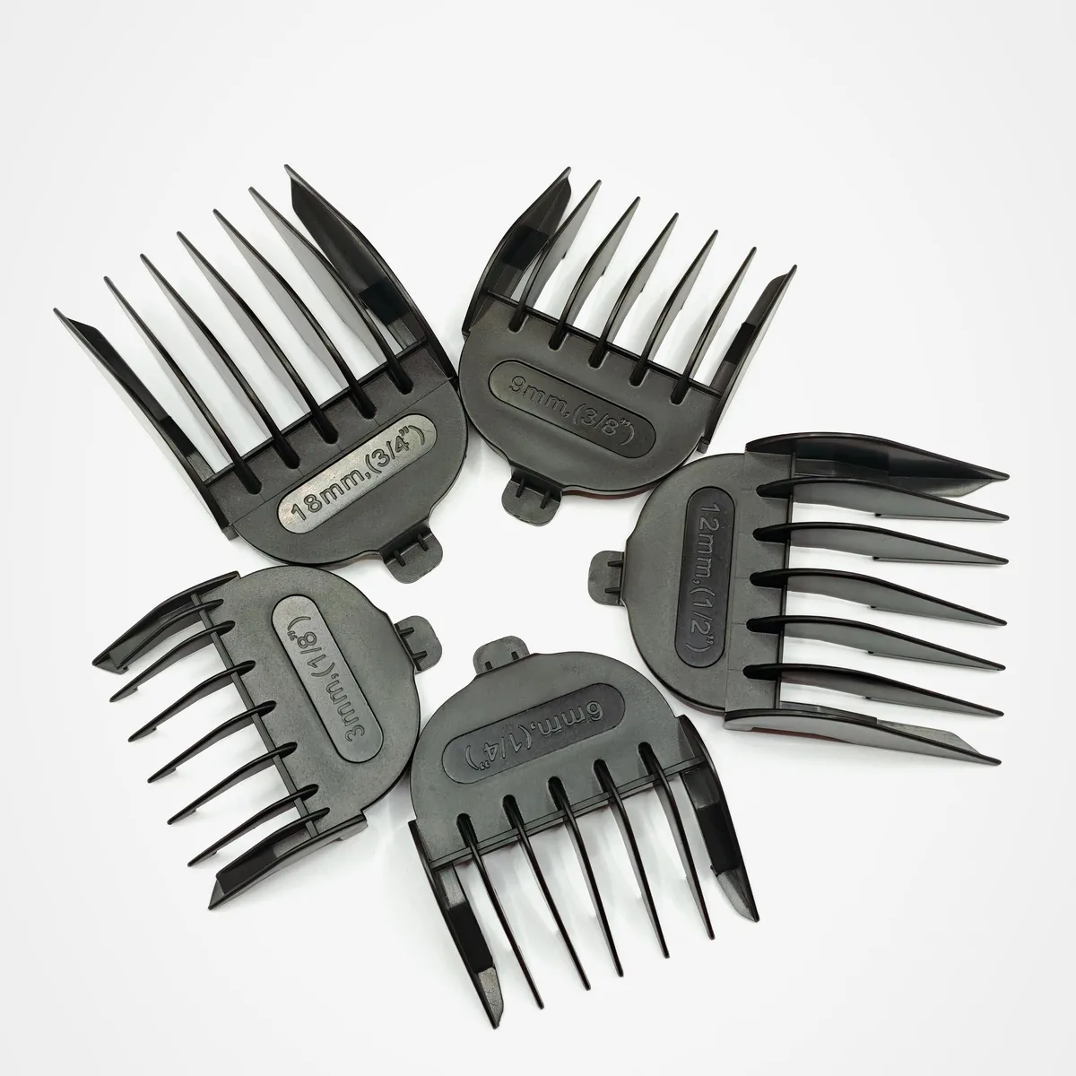 Black plastic guide comb set, five pieces, sizes 3mm to 18mm