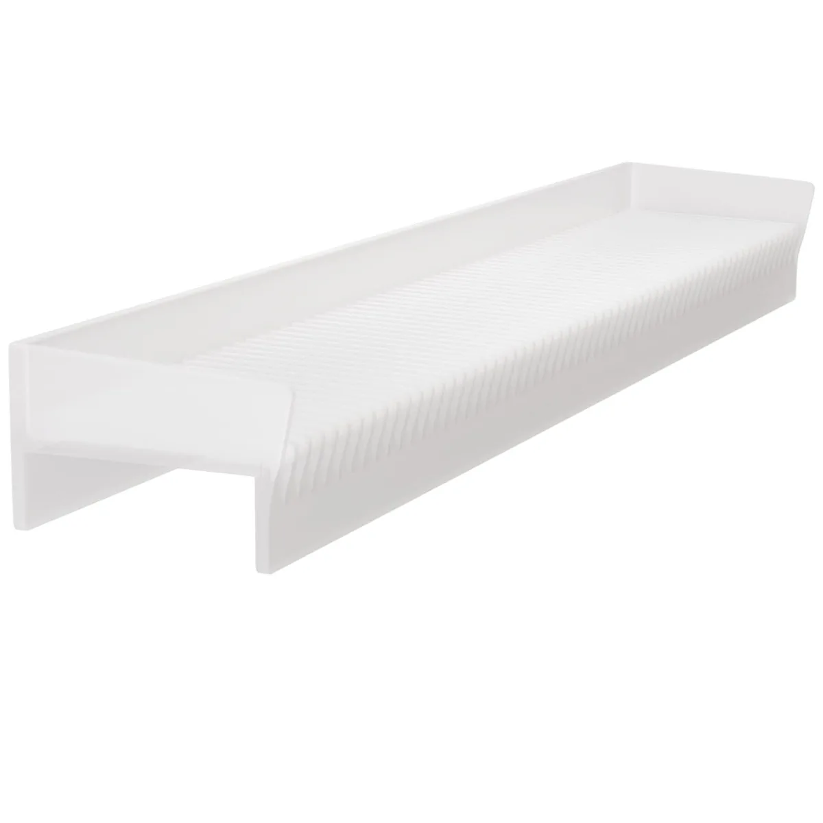 Flexible white silicone strip with raised ridges lying flat on a countertop edge