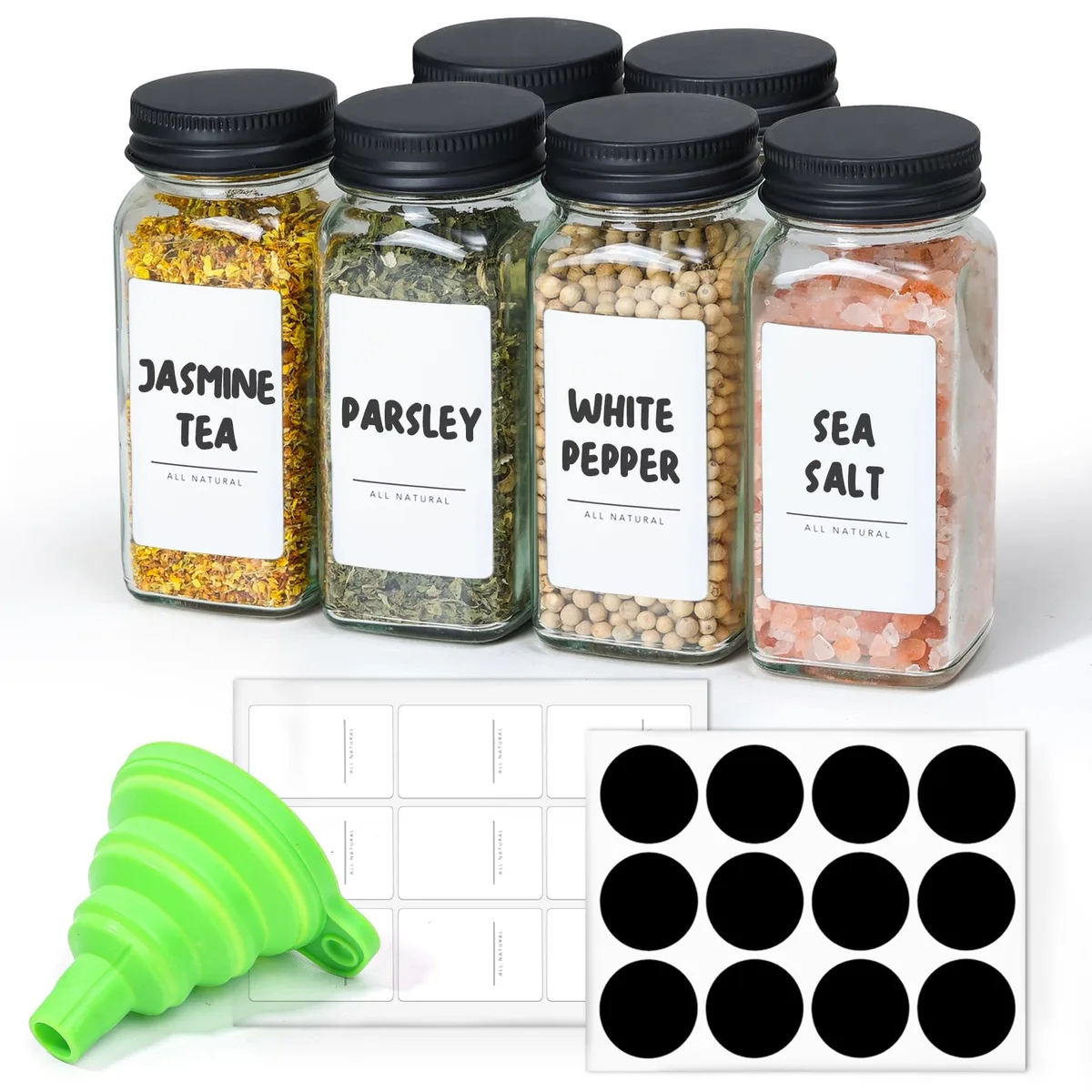 Six clear square glass jars with black lids and labels