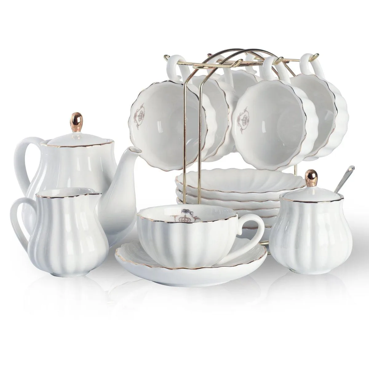 White porcelain tea set for six with pumpkin shaped cups, gold trim, teapot, sugar bowl, creamer, spoons and strainer