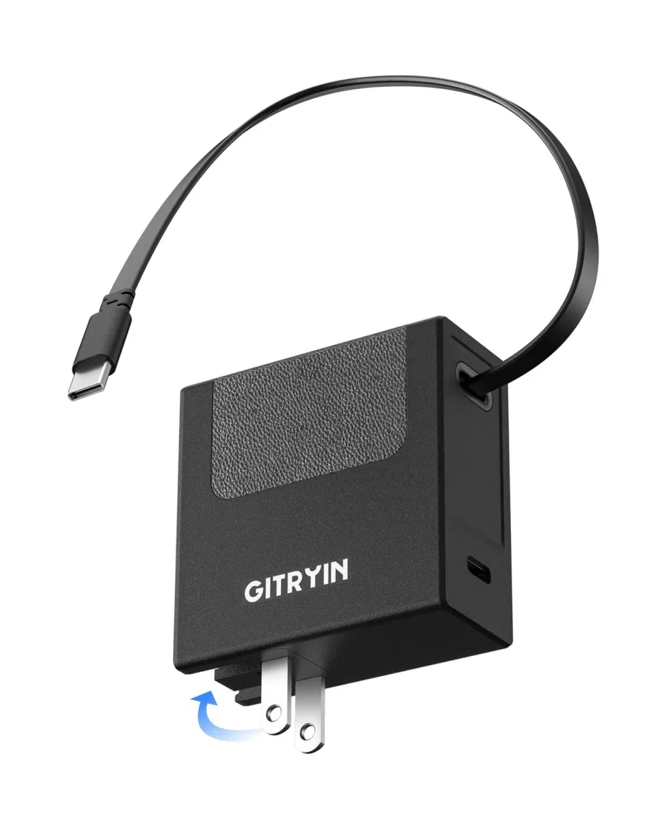Black rectangular wall charger with foldable prongs and a built-in retractable USB-C cable extending outward