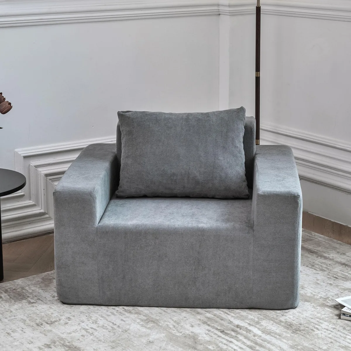 Grey polyester foam sofa with pillow in box