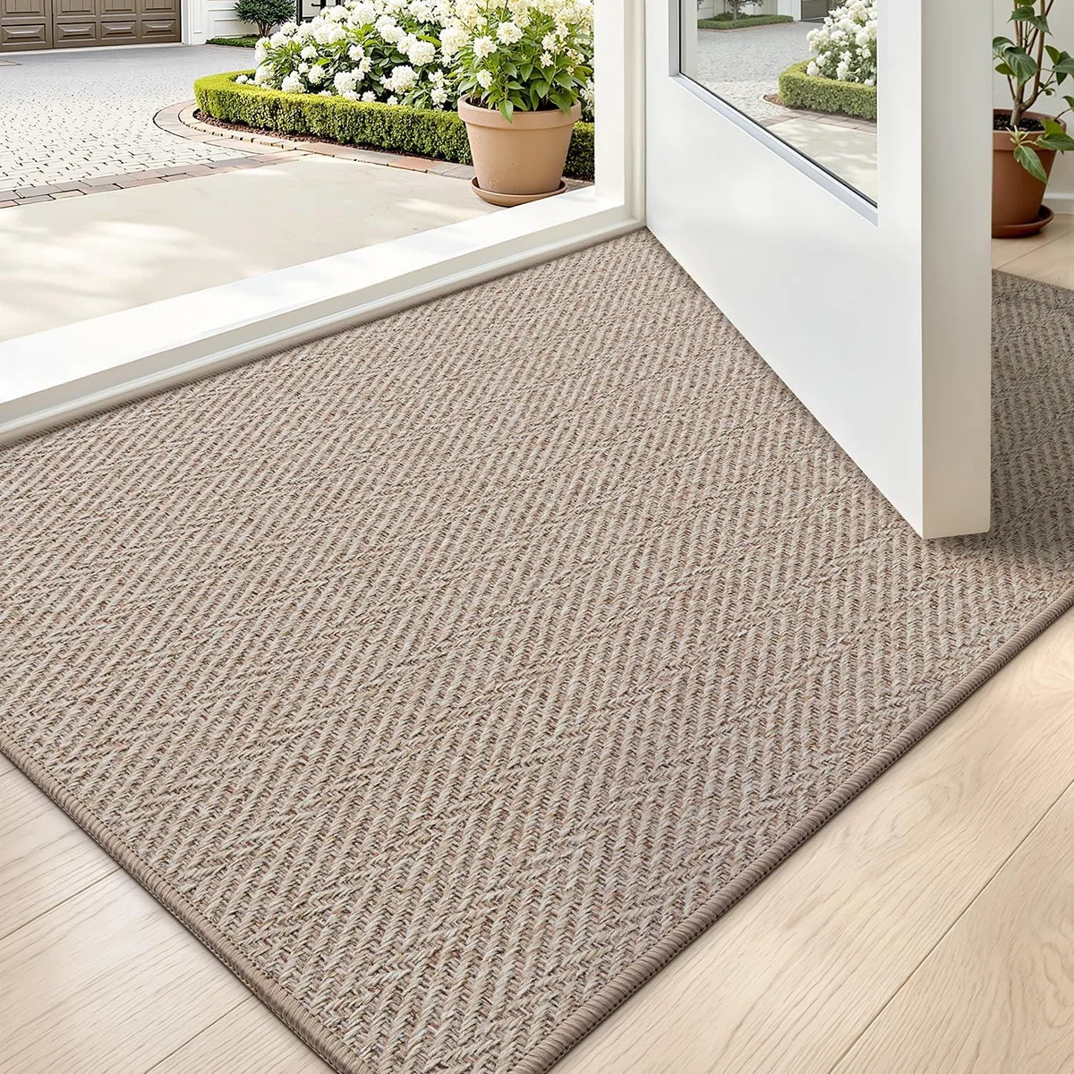 Ultra-thin beige herringbone doormat with rubber backing, 24 by 36 inches