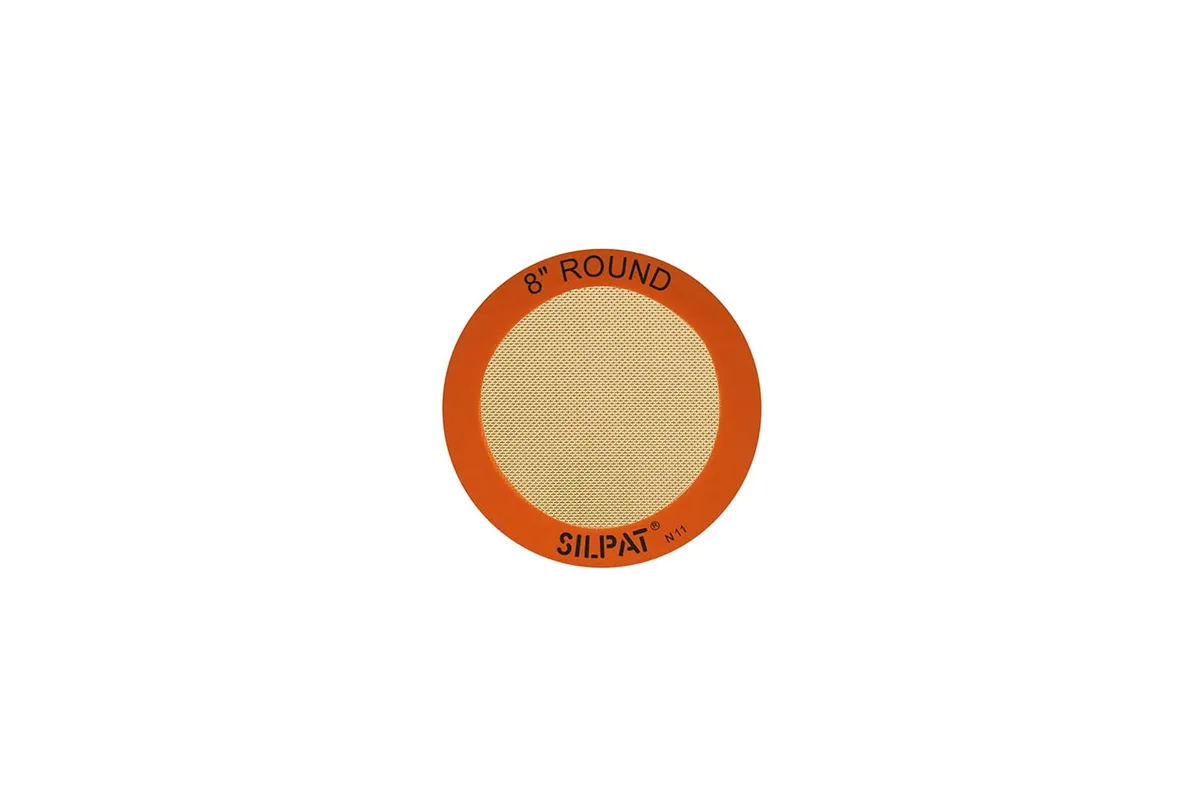 Orange round silicone baking mat, 8 inch diameter, flexible non-stick surface