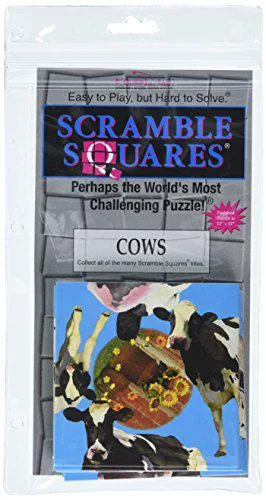Small square box with cow-themed puzzle pieces inside