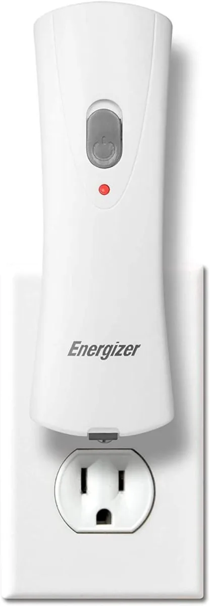 Compact white rechargeable flashlight with fold-out plug, auto-on LED beam reaches 30 meters