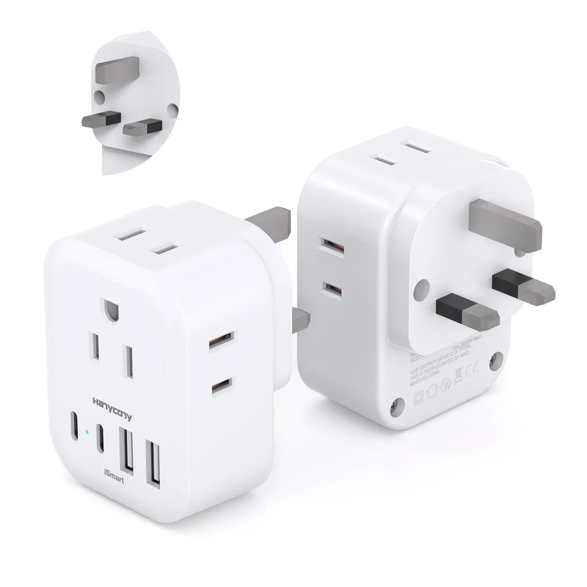 White rectangular Type G travel adapter with four AC sockets and four USB ports on three sides