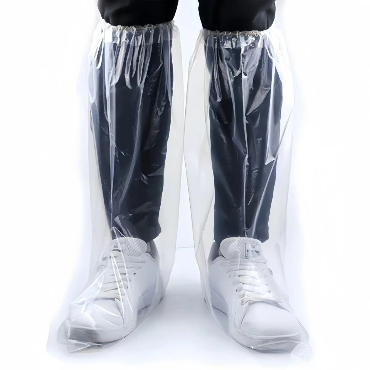 Sixteen clear disposable PE shoe covers, 19 inch tall, elasticated openings, textured non-slip soles