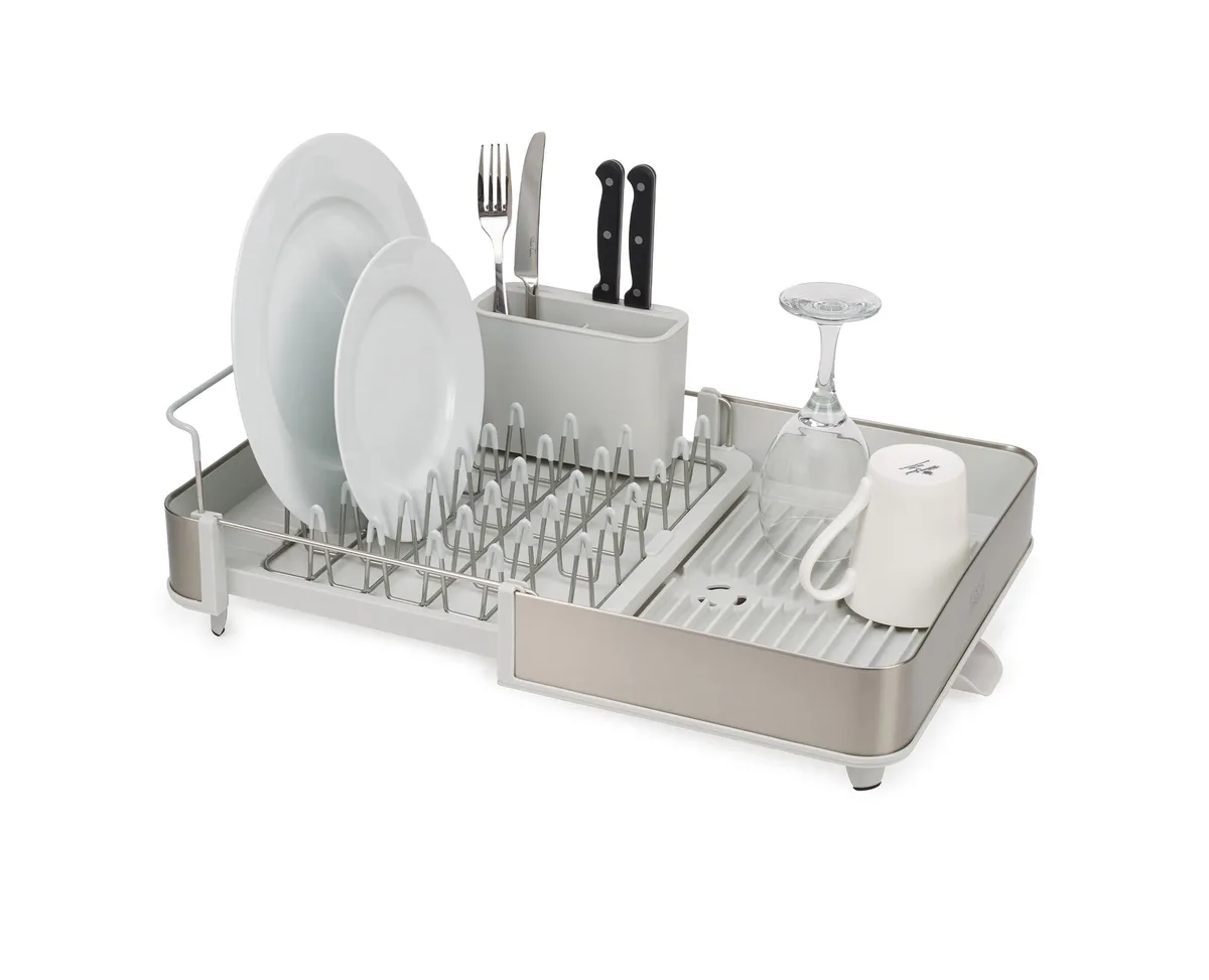 Stainless steel expandable dish rack with sliding tray, cutlery holder and swivel spout in Light Stone finish