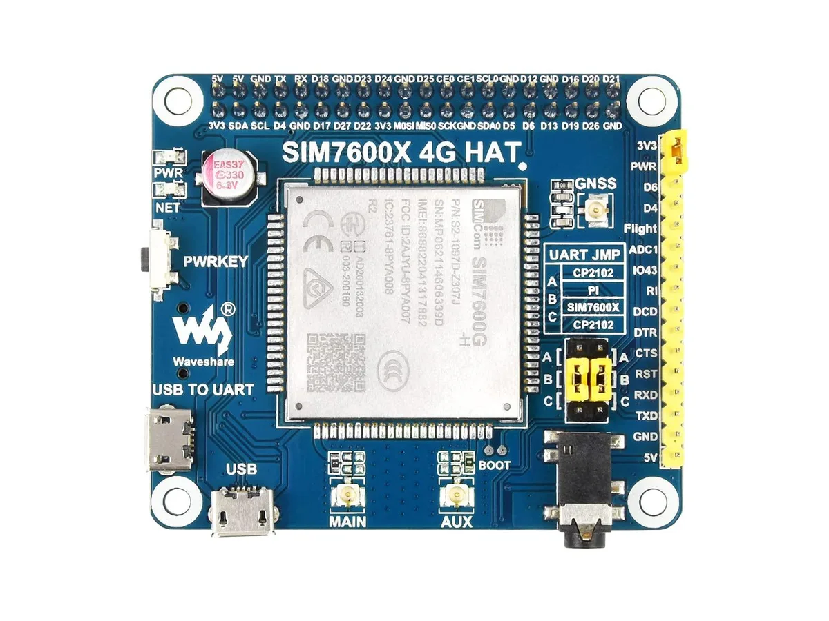 Green rectangular circuit board with gold GPIO header, USB port, SIM and microSD slots, audio jack, and two status LEDs