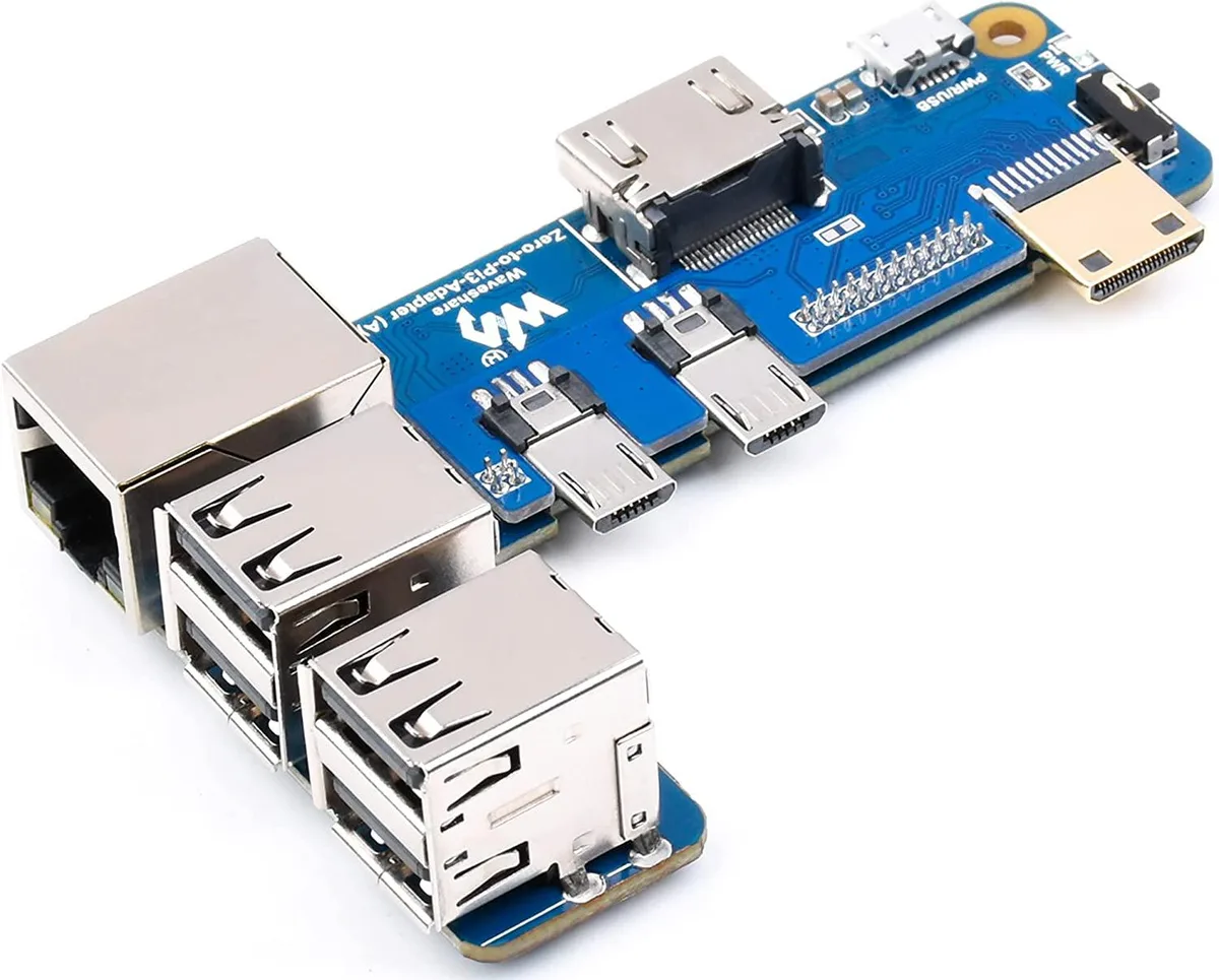 Green rectangular PCB adapter board with four USB ports, RJ45 Ethernet jack and 40-pin GPIO header