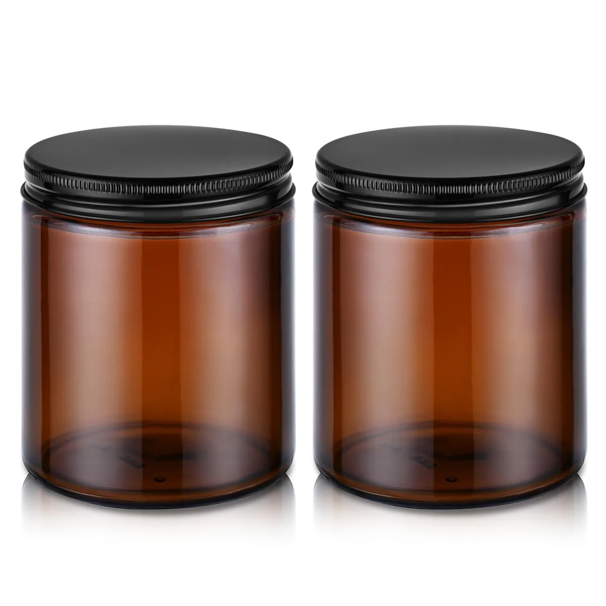Two small amber glass jars with metal screw lids