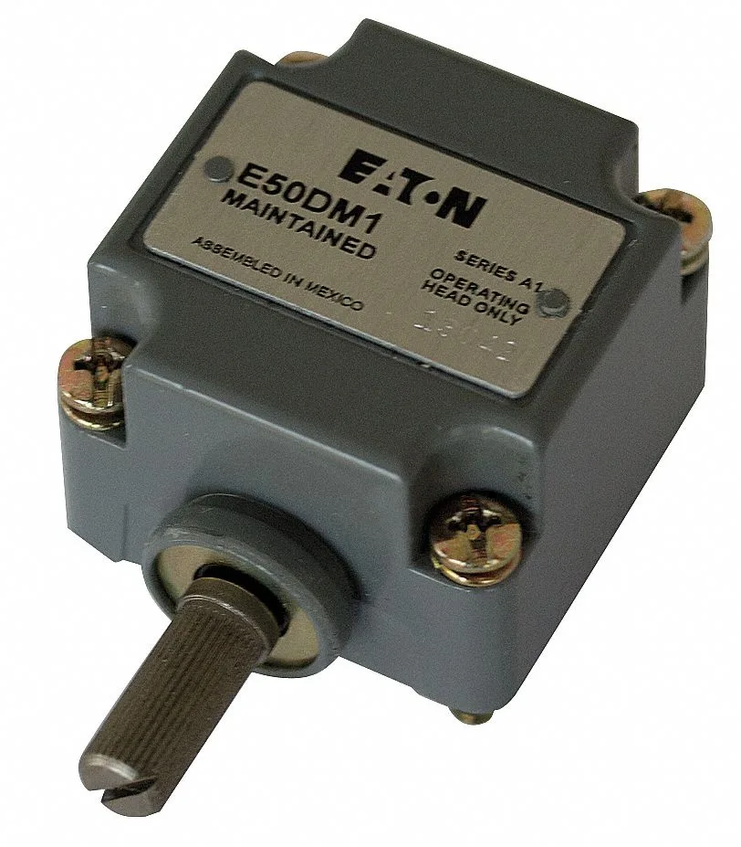 Small metal limit switch head with a short side-mounted rotary lever, matte grey finish