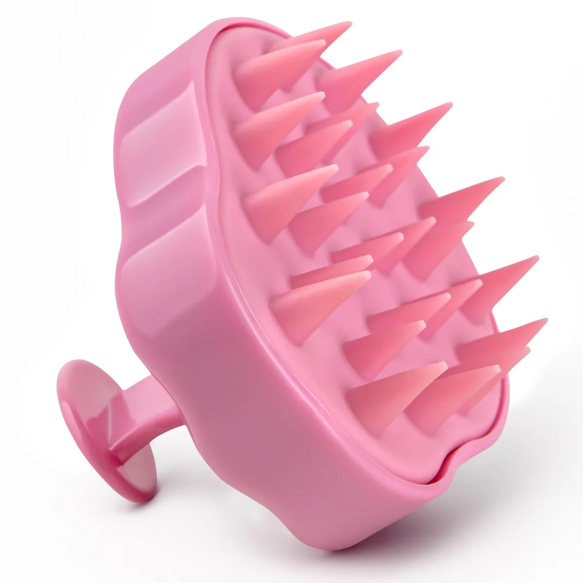 Pink silicone scalp massager with soft flexible bristles and ergonomic handle
