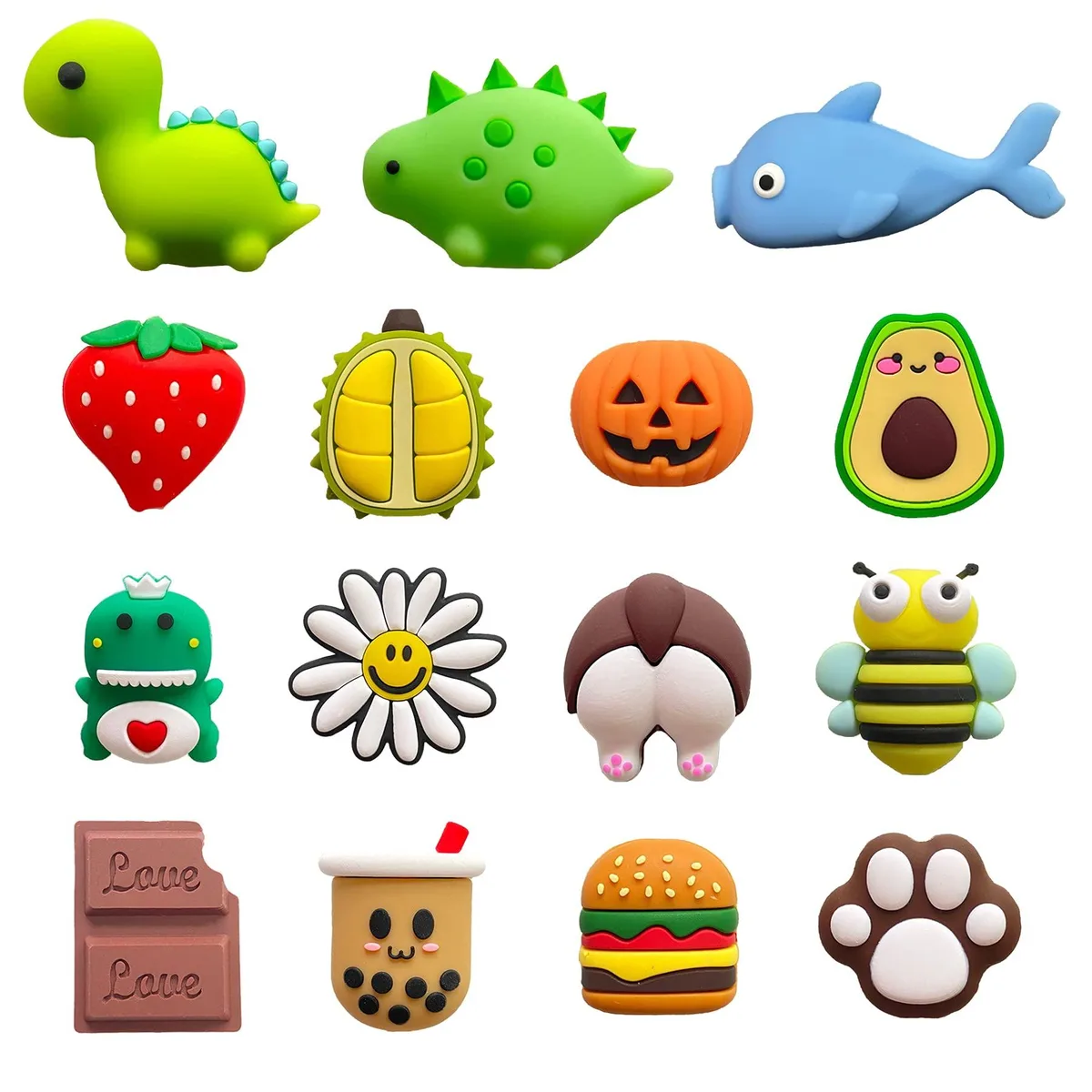 Fifteen PVC cable protectors in orange, animal and fruit shapes on a surface