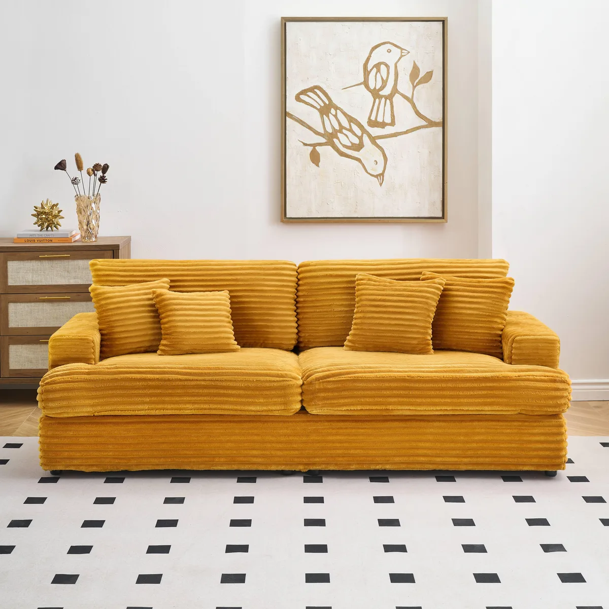 Orange corduroy three-seater sofa with four matching pillows