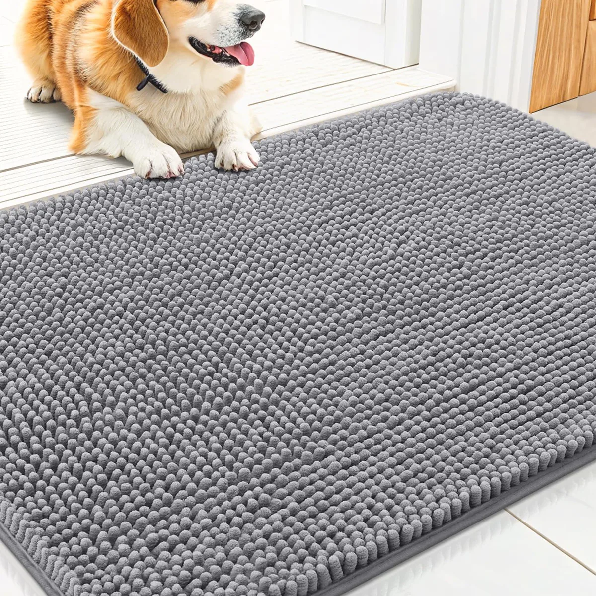 Grey rectangular polyester door mat with chenille pile and rubber backing, 30 by 20 inches