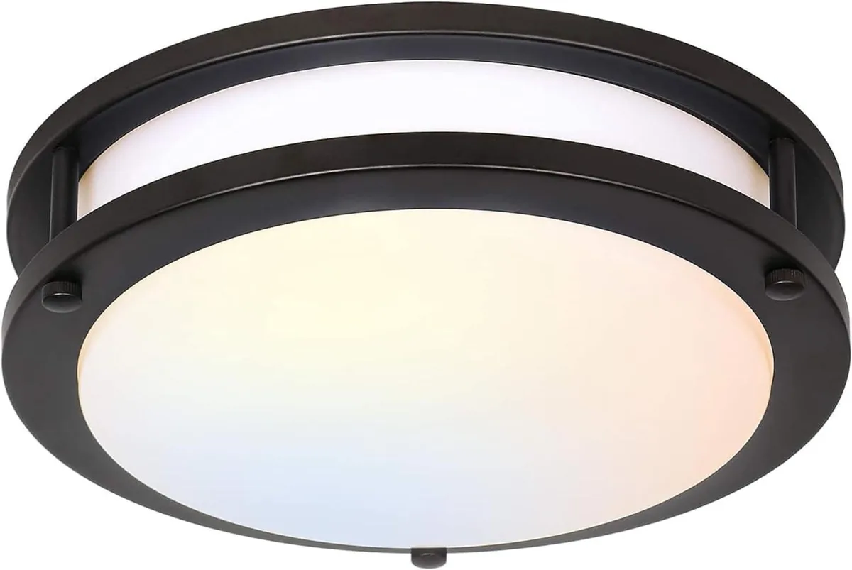 Round 13 inch flush mount ceiling light with black metal frame and white acrylic diffuser