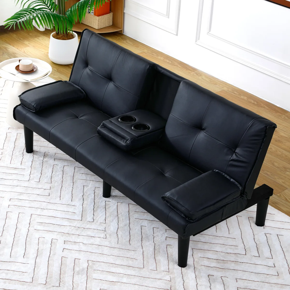Black PVC sofa bed, 67 inches wide, with foldable design and built-in cup holder