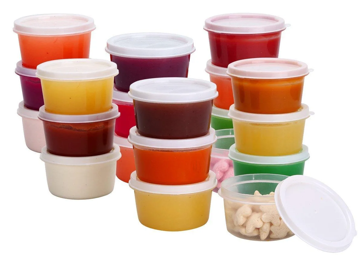 Twenty small red plastic containers with matching lids stacked together