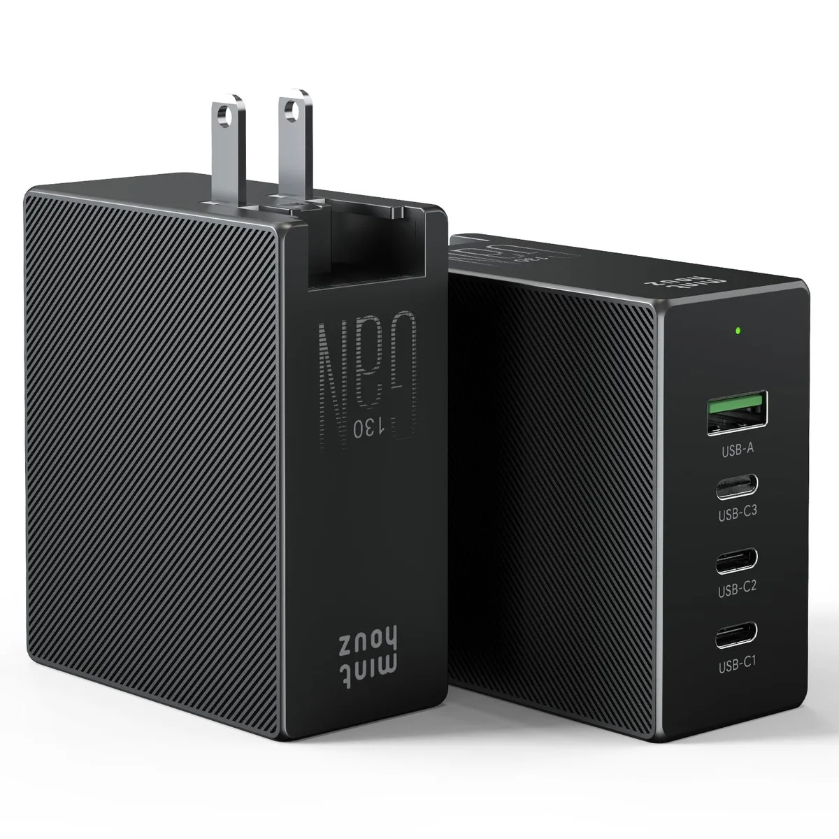 Compact black GaN wall charger with three USB-C ports, one USB-A port and foldable plug