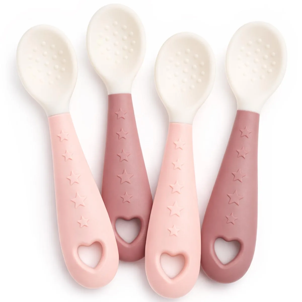 Four silicone baby spoons, two pink two purple, soft rounded bowls with easy-grip handles