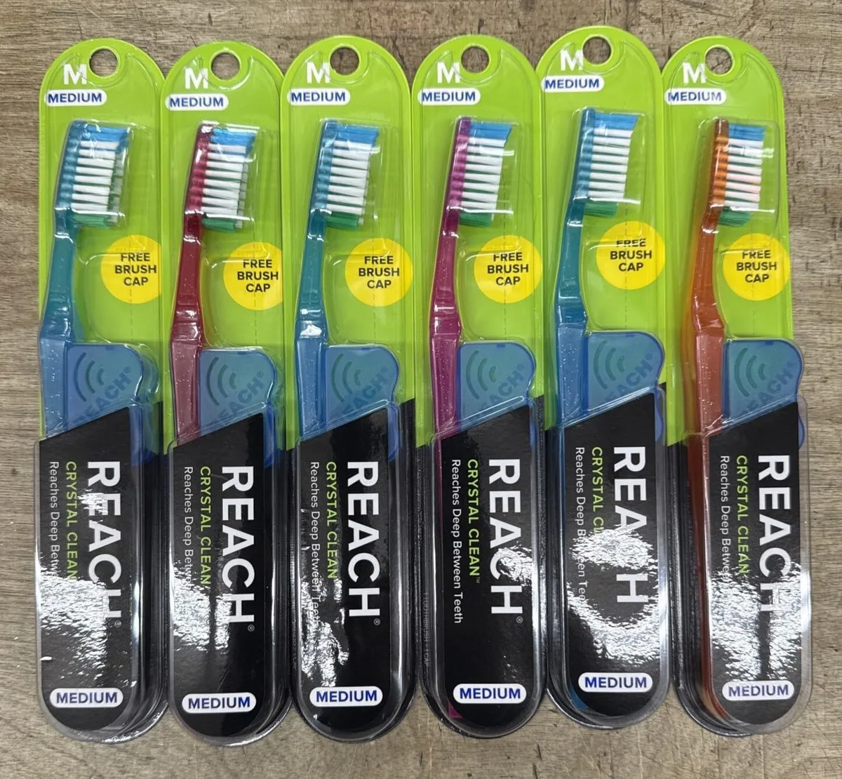 White manual toothbrushes with angled necks, assorted handle colours, pack of six