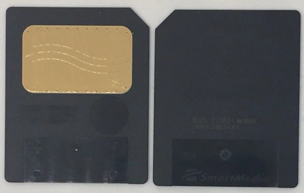 Small rectangular SmartMedia card, gold contacts visible, 4 MB capacity