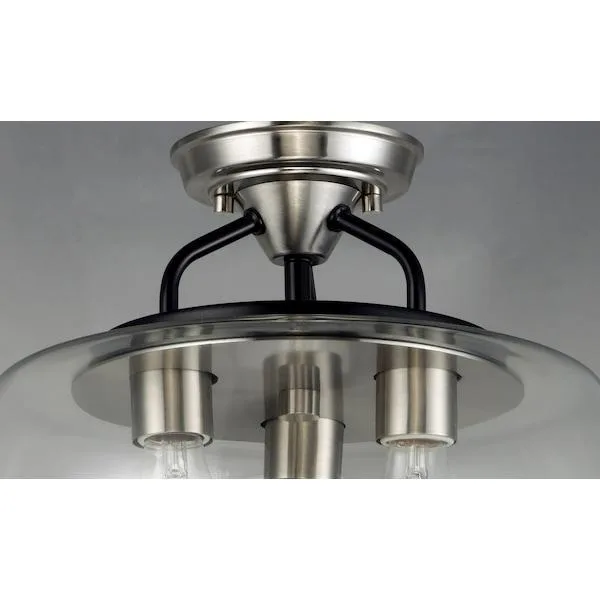 Three-light flush mount with clear goblet glass shades, black frame and satin nickel accents