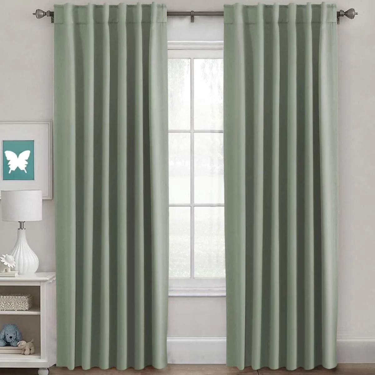 Pair of light sage microfiber blackout drapes, 52 by 84 inches each, rod pocket and back tabs visible