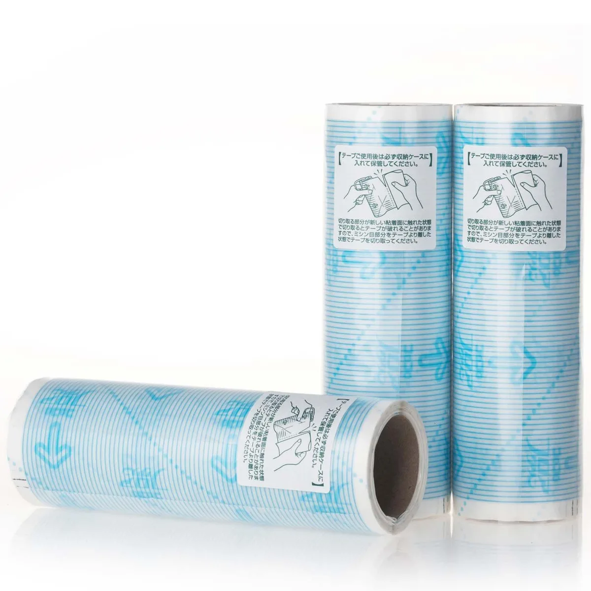 Three packs of white adhesive refill rolls in plastic housing