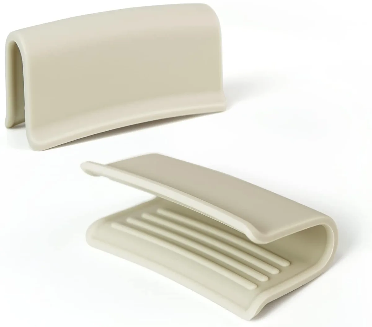 Two cream silicone pot handle covers with ribbed inner texture
