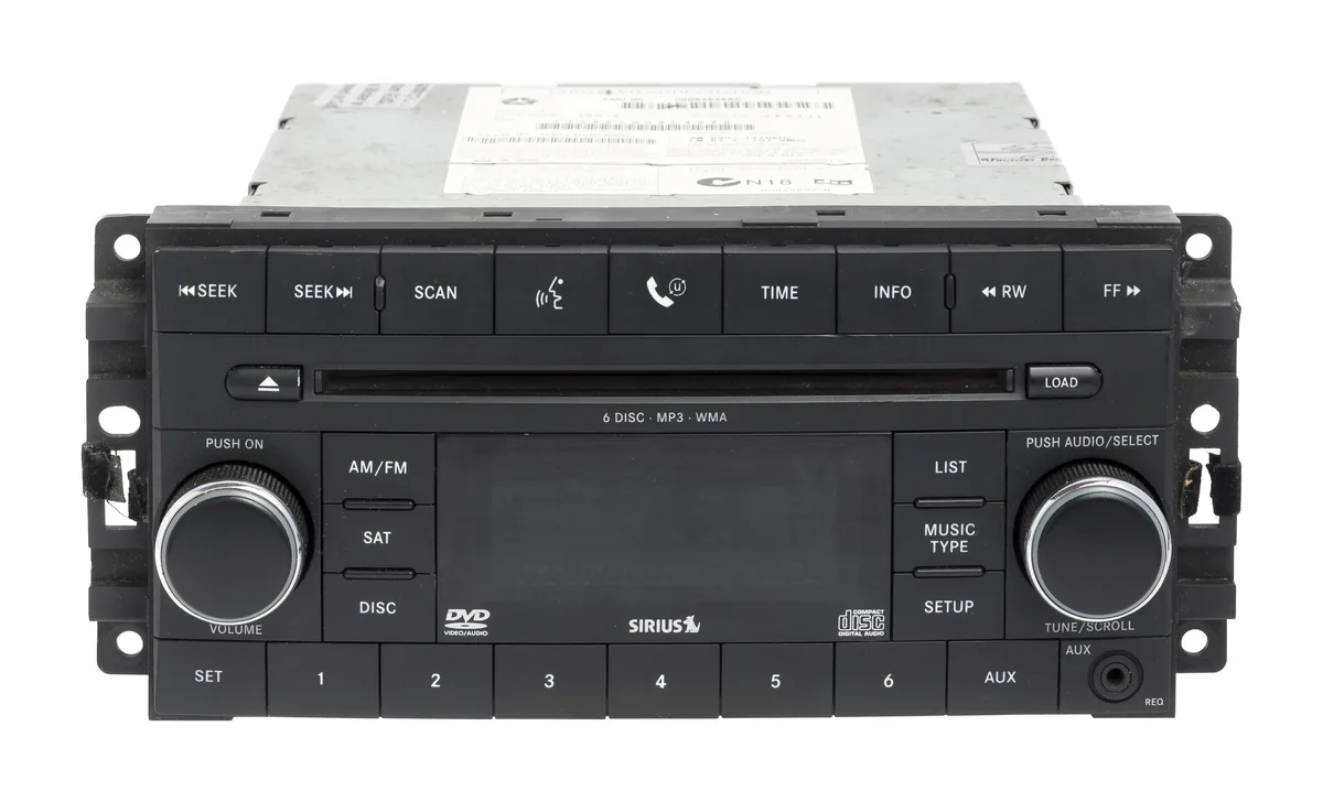 Factory radio unit black rectangular faceplate with display and disc slot