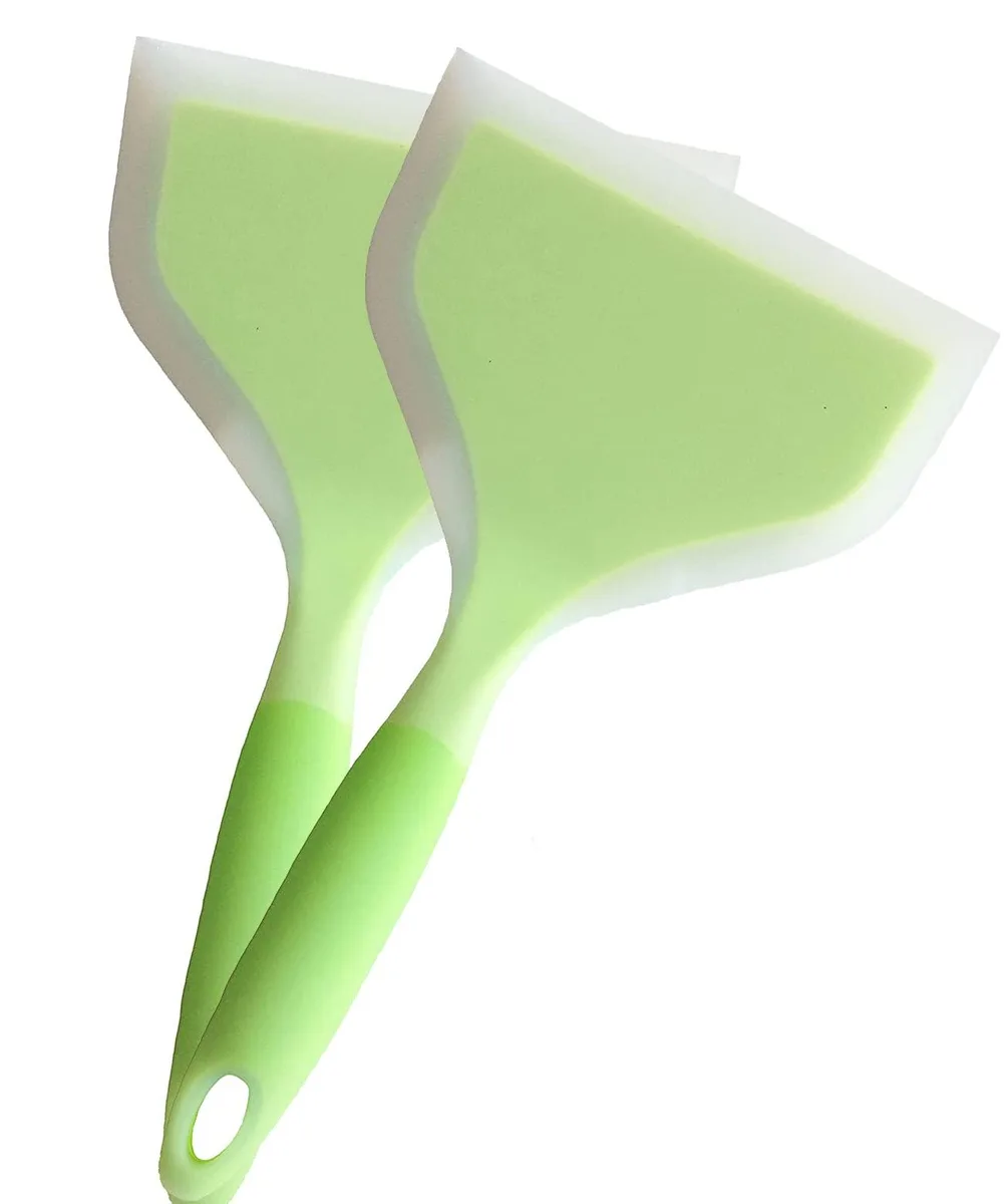 Two green silicone spatulas, flat rectangular heads, one-piece construction, hanging holes