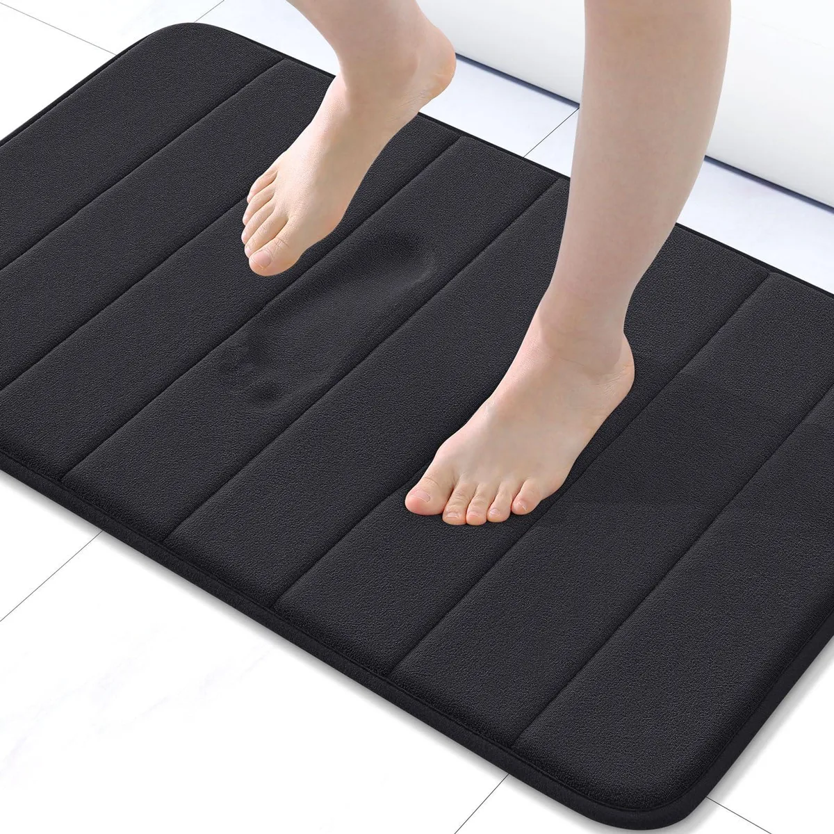 Black rectangular bath mat, memory foam with microfiber velvet surface, 30 by 20 inches