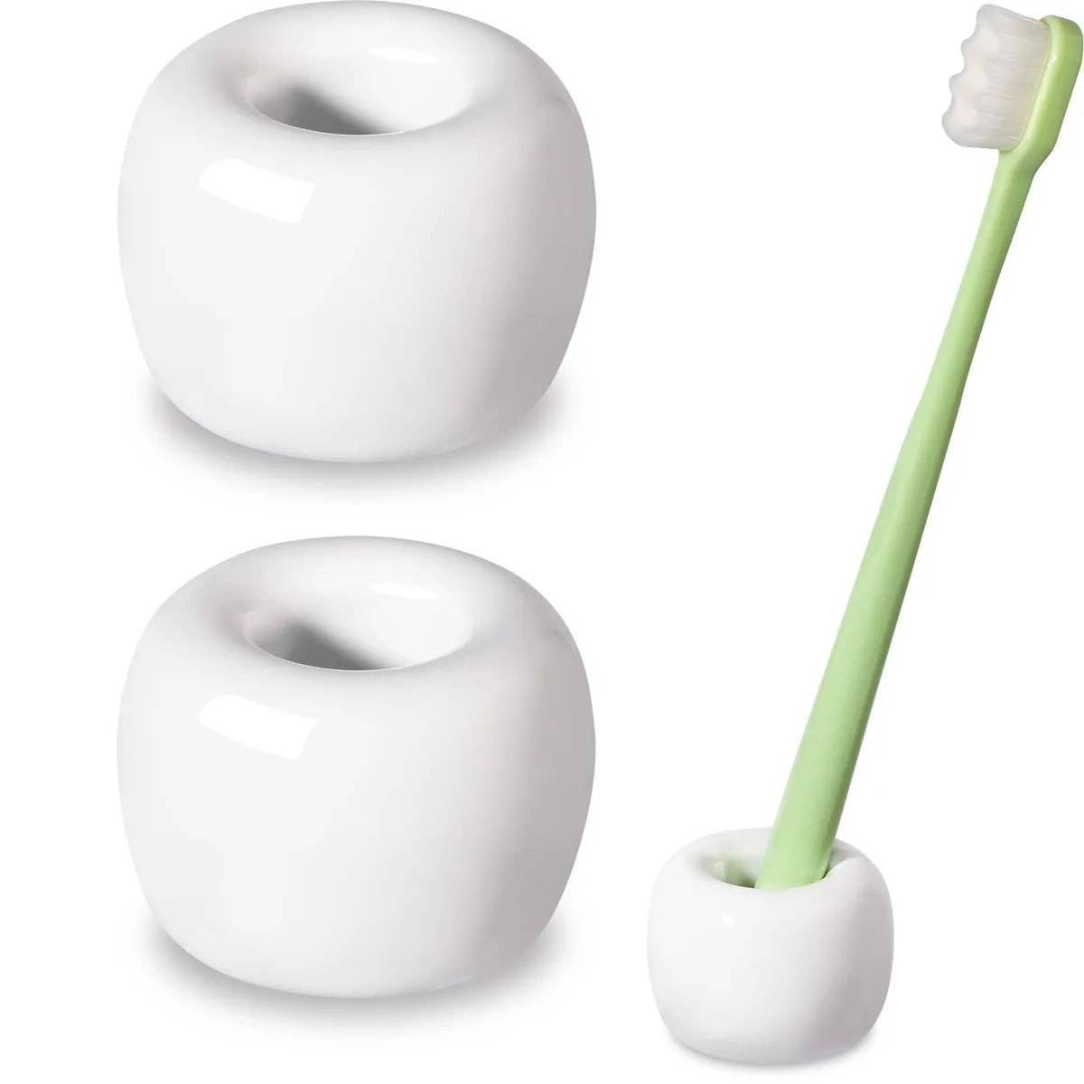 Two small white ceramic cylinders with hollow centres, smooth matte finish, non-slip bases