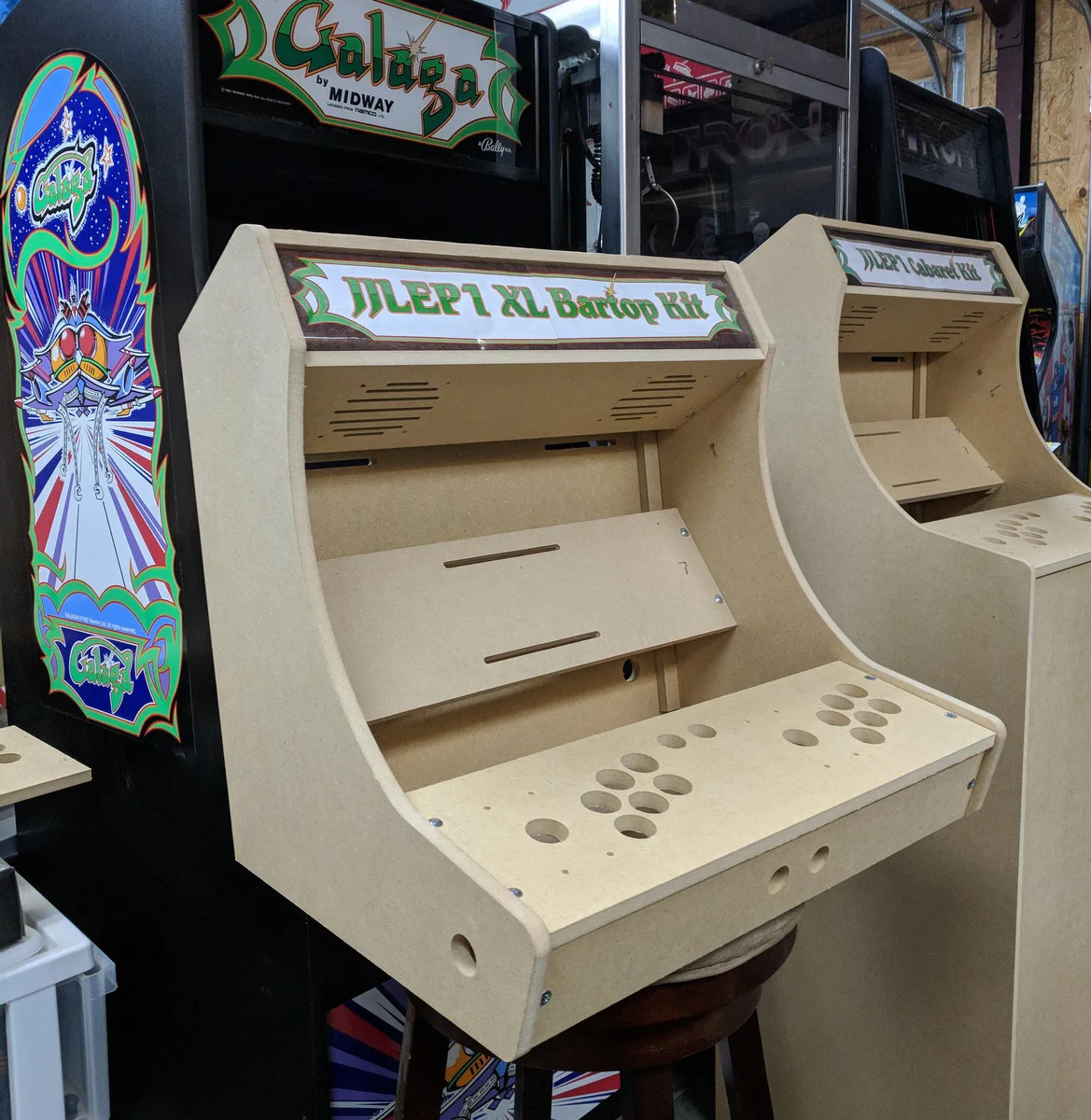 Flat-pack MDF arcade cabinet kit with pre-drilled Sanwa button layout and marquee slot