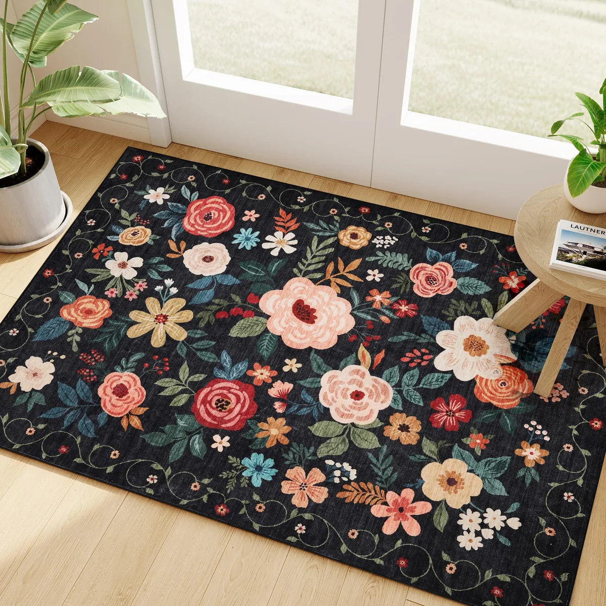 Rectangular black polyester rug with vintage floral pattern and non-slip backing