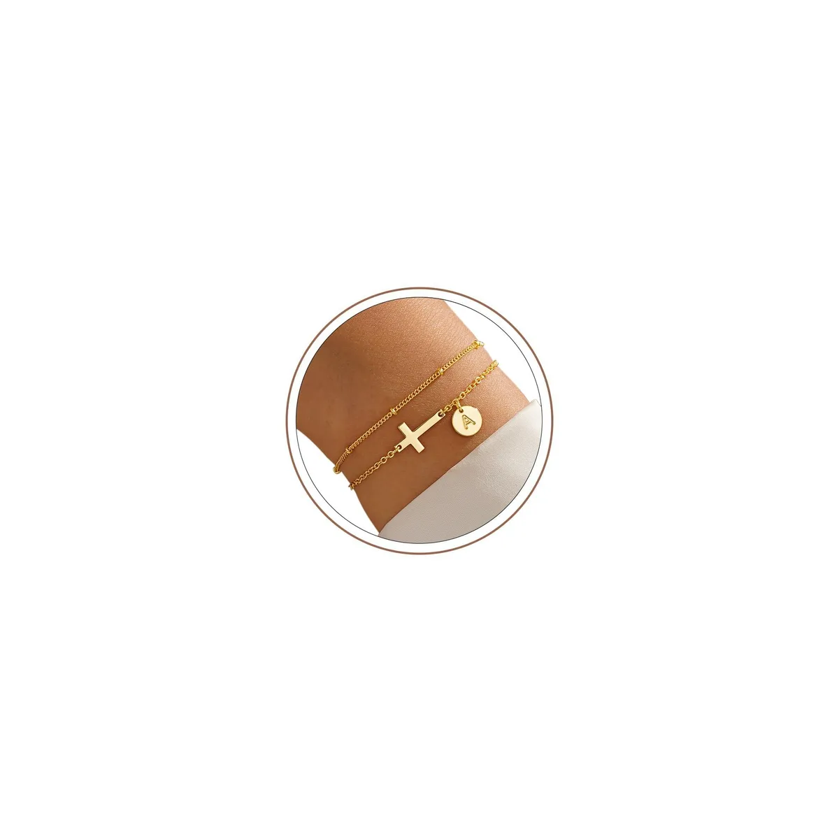 Gold-tone bracelet with letter A charm and cross pendant on adjustable chain