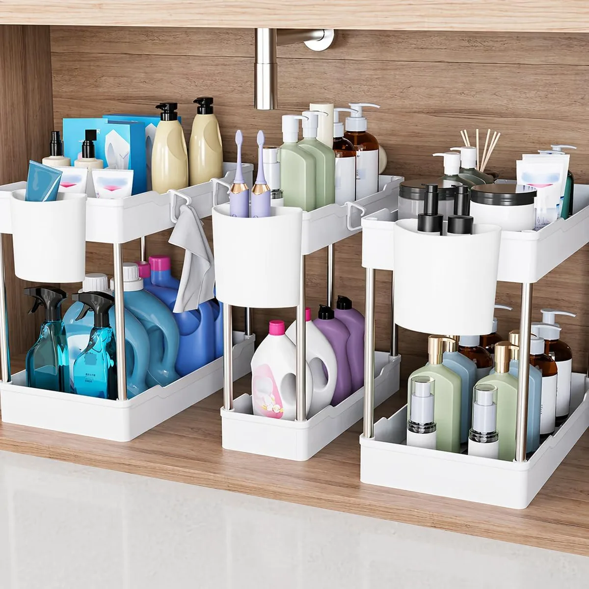 Three white two-tier plastic shelves with metal frames, hooks and hanging cups