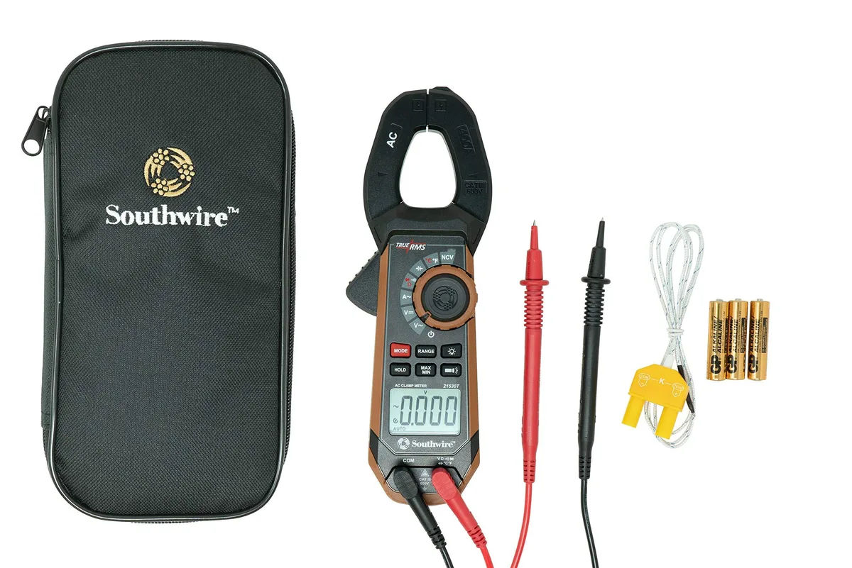 Black and brown clamp meter with jaw open, test leads and case visible