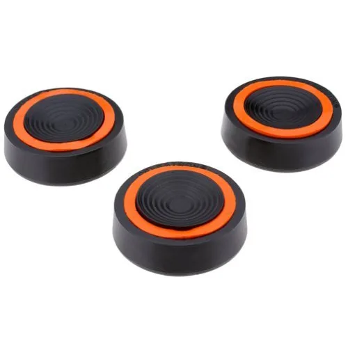 Three dark circular pads with tripod-leg indentations on a light surface