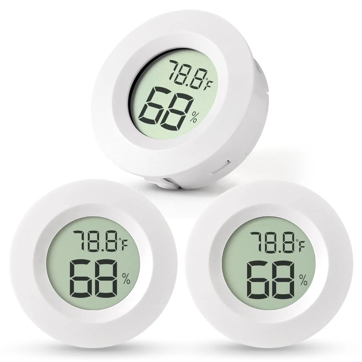 Three small square white hygrometer thermometers with digital displays