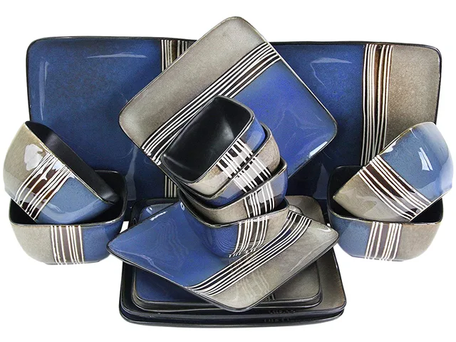 Sixteen-piece stoneware dinner set in muted tones, four each of dinner plates, salad plates, large bowls, dessert bowls