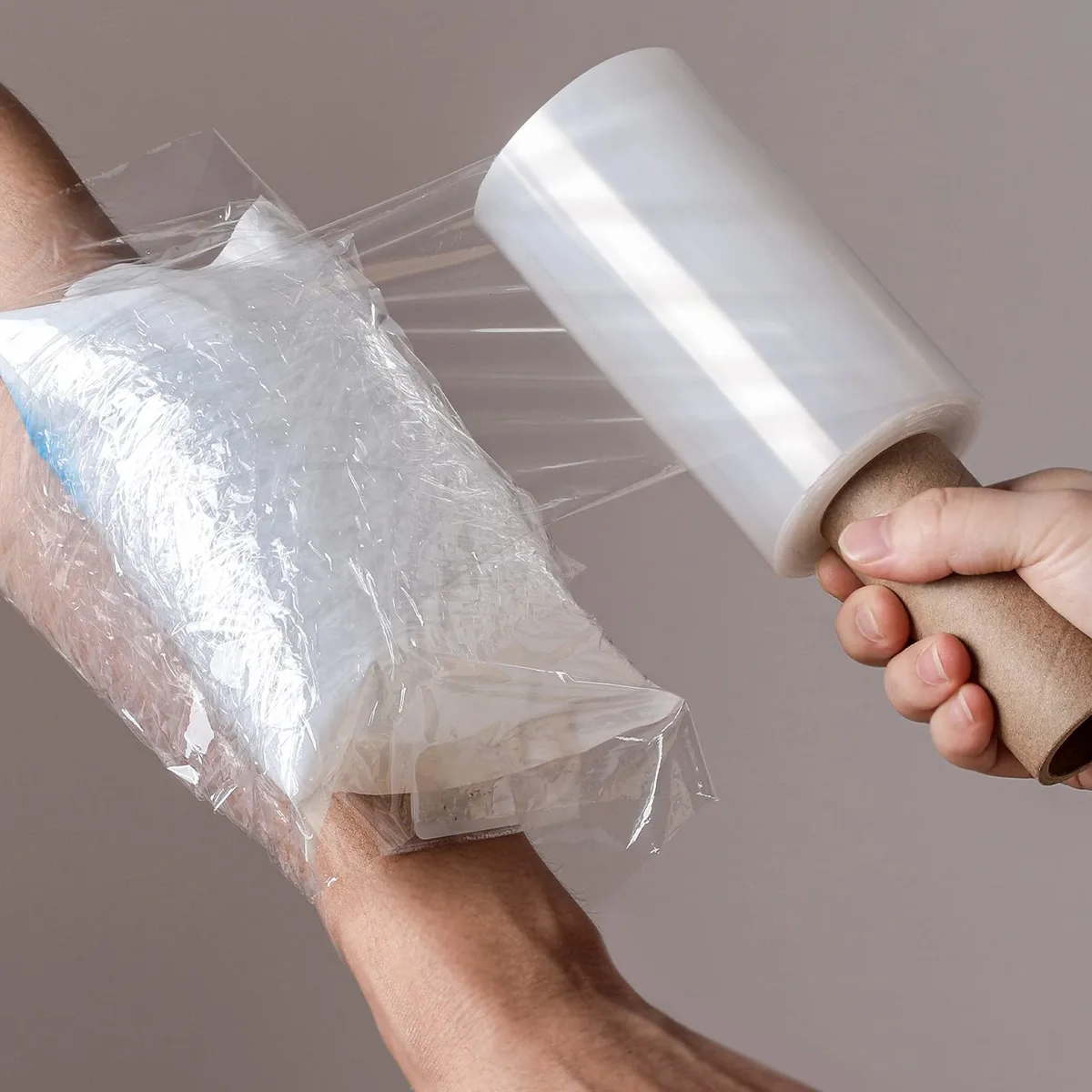 Clear self-adhesive film roll with handle, 12 cm wide, 150 m length