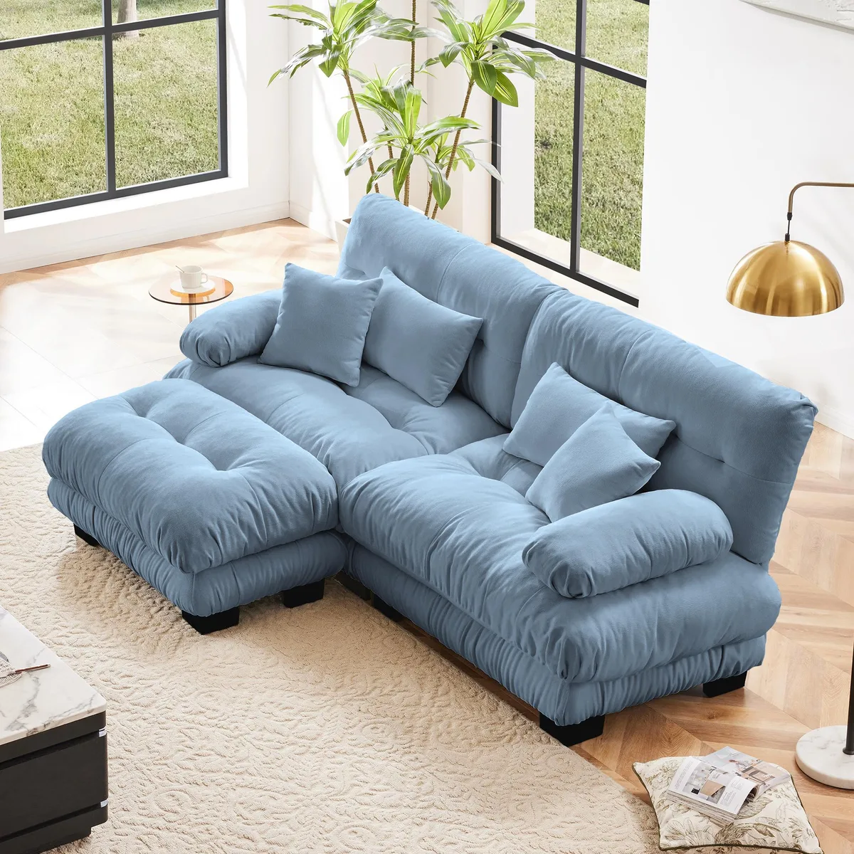 Blue chenille two-seater sectional with wide rounded arms and matching pillows